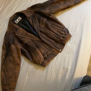 Brown leather heavy vintage bomber jacket in as new condition. Size Large.